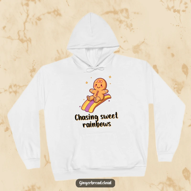 Funny hoodie featuring a gingerbread character gleefully sliding down a bright rainbow, offering warmth and a touch of magic.