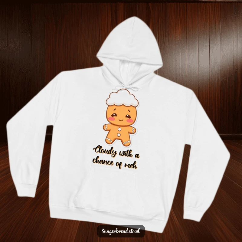 Funny gingerbread cookie character with a goofy face, sporting a little cloud hat, featured on a cozy hoodie for warm humor.